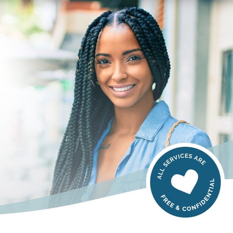 A woman smiling because she knows All Pregnancy Services are Free & Confidential at Choices Resource Center in Cedar Rapids, Iowa