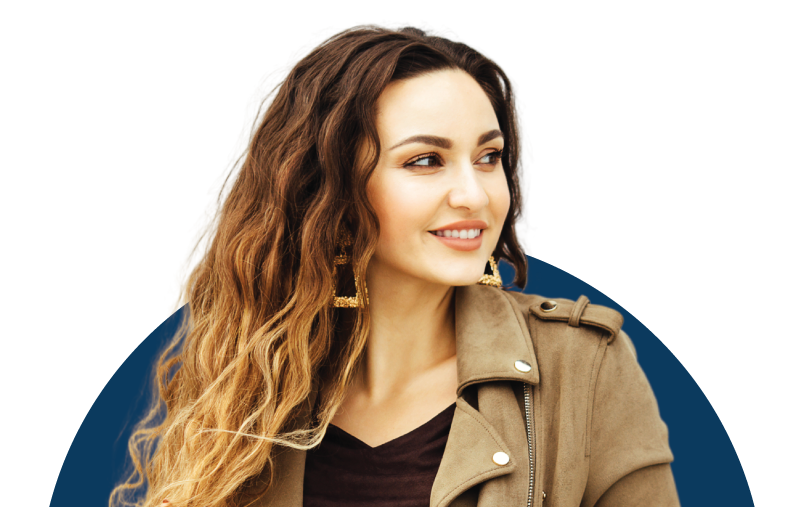 A woman smiling because she knows she can get the care and support she needs for her pregnancy